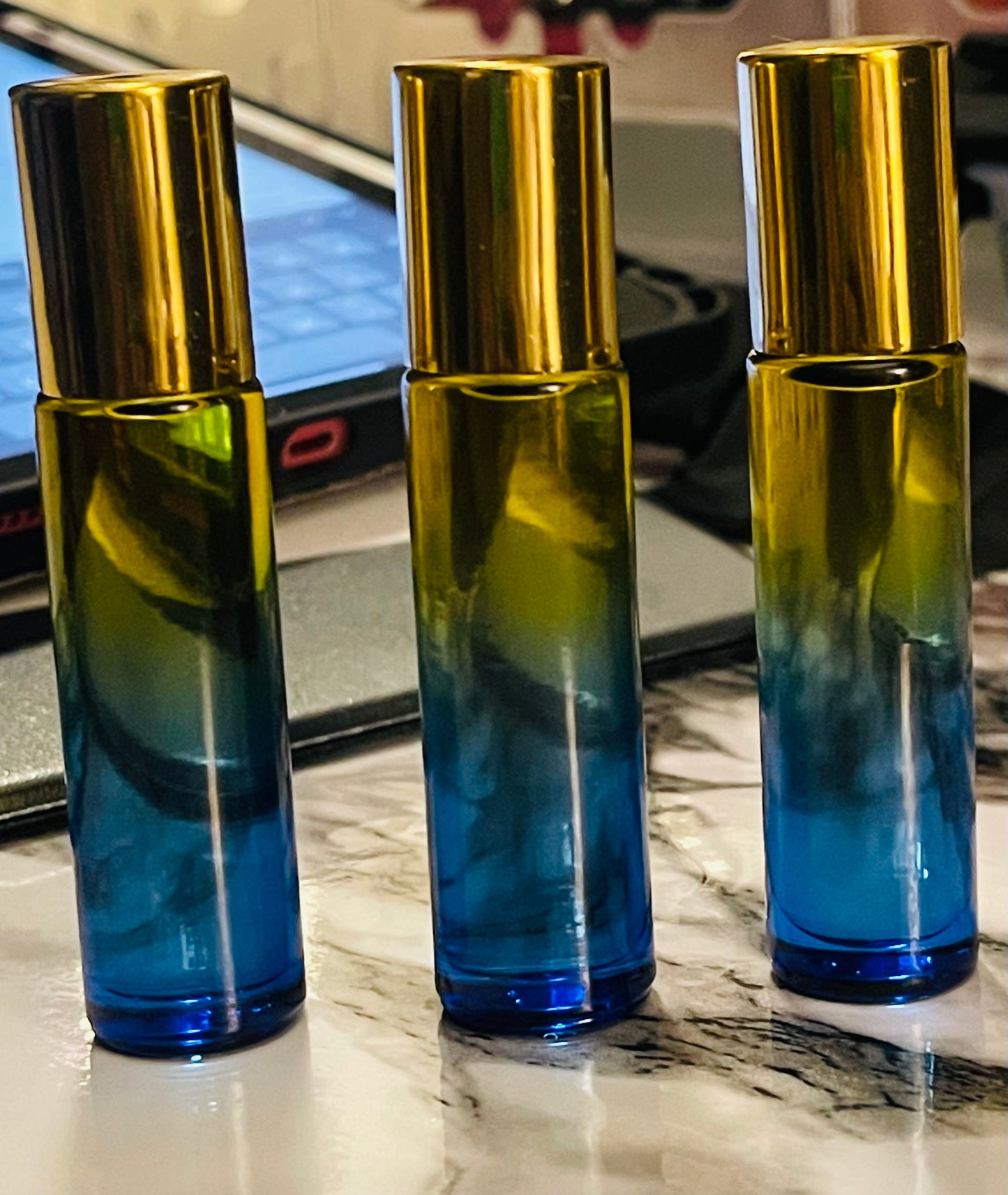 Oshun Cashmere glass rollerball face and body oil.